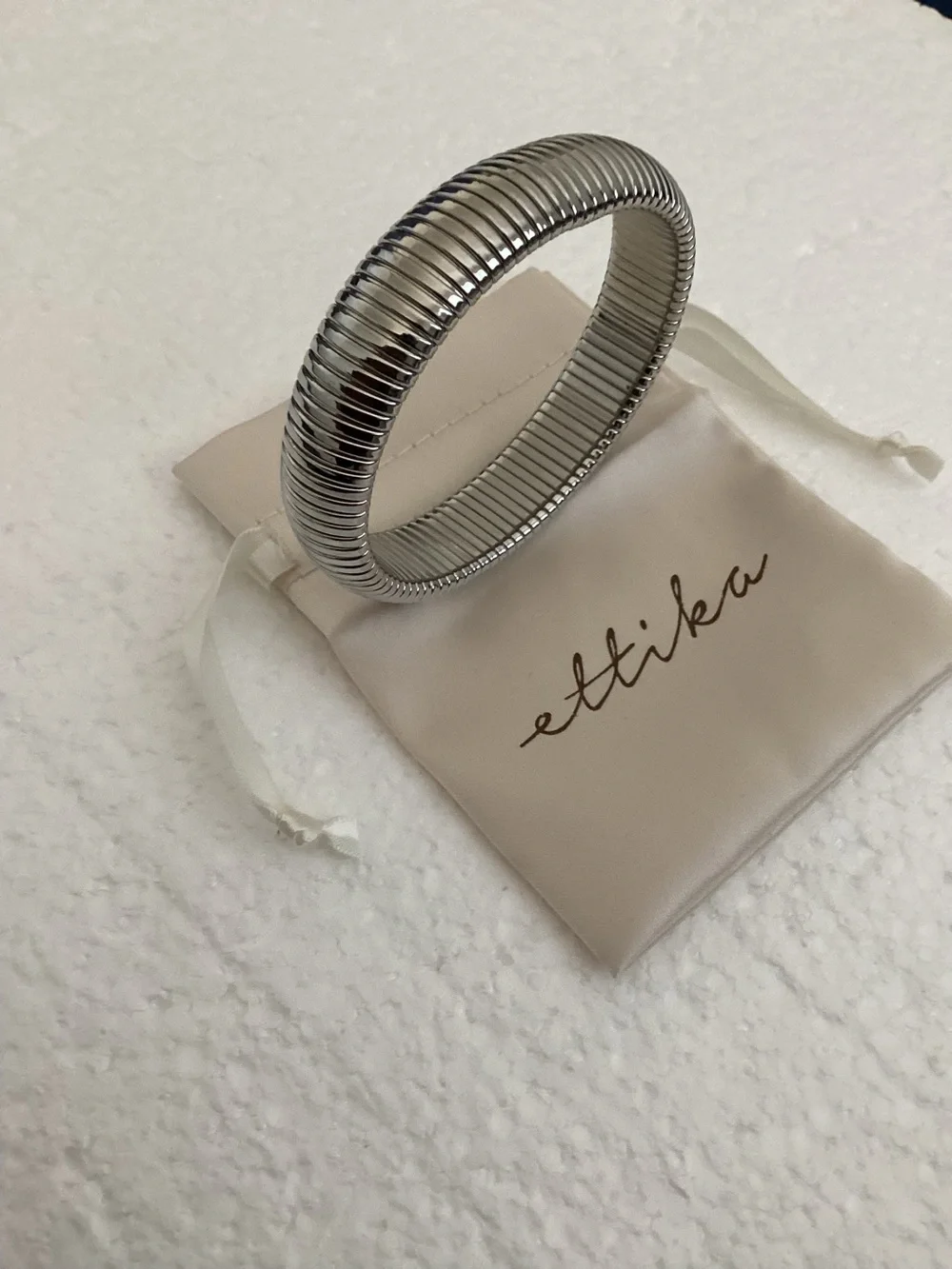 This Ettika silver-plated flexible tubogas-style stretch cuff silver tone brace